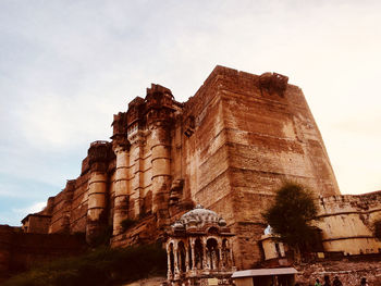 Low angle view of old ruins against sky