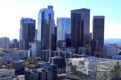 High angle view of buildings in city against clear sky