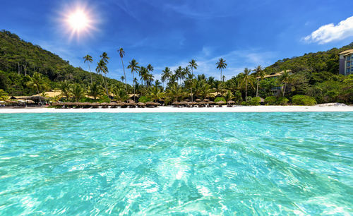 Scenic view of sea against blue sky