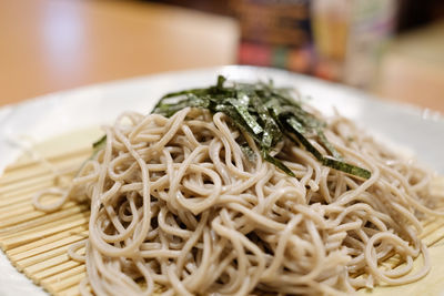 Close-up of noodles in plate on table