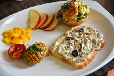 High angle view of breakfast served in plate on table