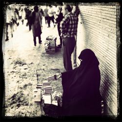 Woman standing by tree