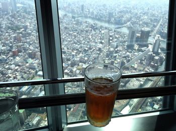 Close-up of drink on glass window