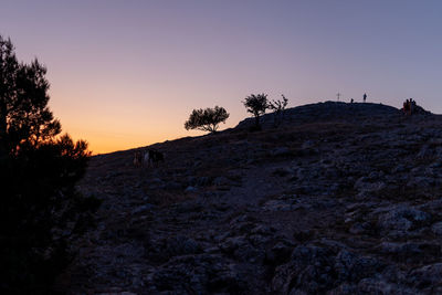 Scenic view of silhouette landscape against clear sky during sunset