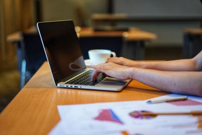 Man using laptop on table