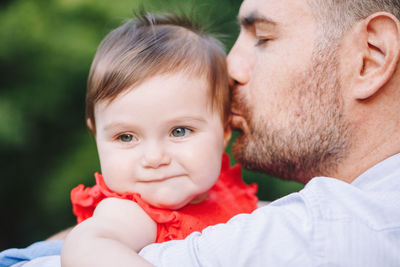 Portrait of father and son baby