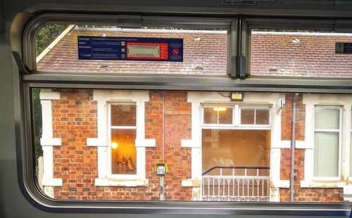 Reflection of building on glass window