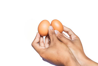 Close-up of human hand against white background