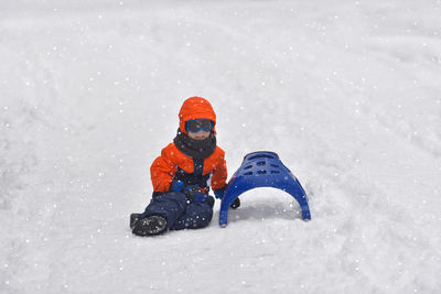 Boy playing in snow