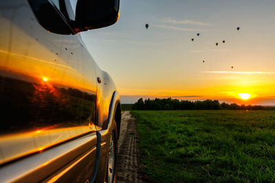 Scenic view of field against sky during sunset