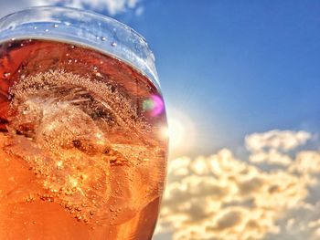 Close-up of ice cubes against sky