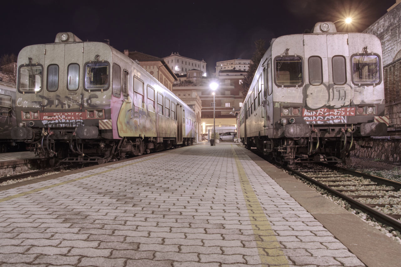 TRAIN AT RAILROAD STATION PLATFORM AGAINST SKY