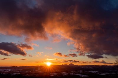 Scenic view of dramatic sky during sunset