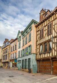 Buildings in city against sky