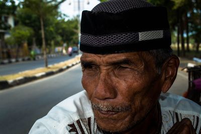 Close-up of senior man wearing taqiyah