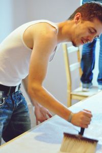 Young worker using brush