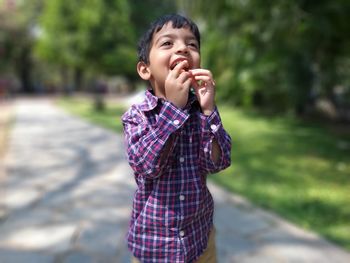 Close-up of boy standing outdoors