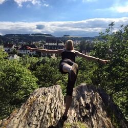 Woman standing on rock