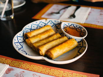 High angle view of fresh food served in plate on table at restaurant