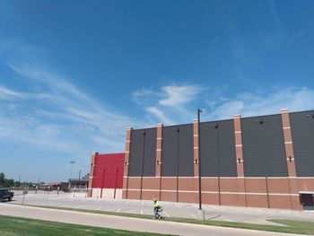 Low angle view of modern building against blue sky