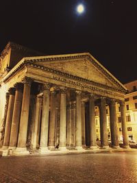 Low angle view of illuminated building at night