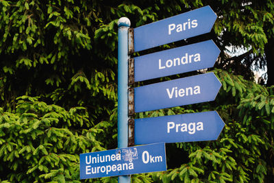 Information sign against blue sky