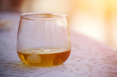 Close-up of beer glass on table