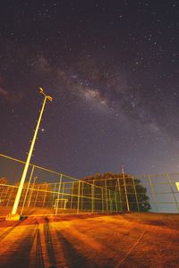 Low angle view of fireworks against sky at night