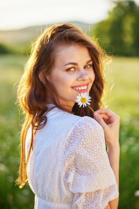 Close-up of young woman looking away