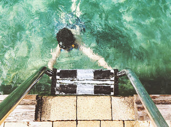 Directly above shot of person swimming in pool