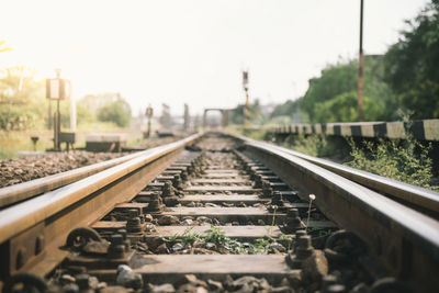 Surface level of railroad tracks against clear sky