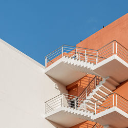 Low angle view of building against clear blue sky