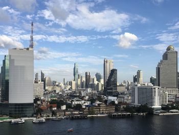 Modern buildings in city against sky