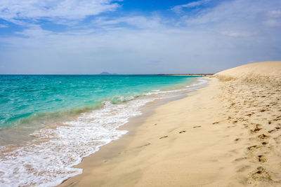 Scenic view of beach against sky