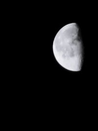 Low angle view of moon against sky at night