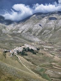 High angle view of castelluccio by mountains