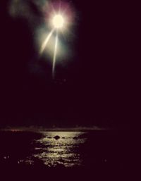 Scenic view of sea against sky at night