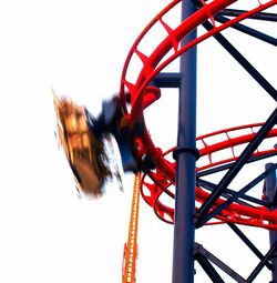 Low angle view of ferris wheel against sky