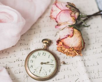 High angle view of clock on table