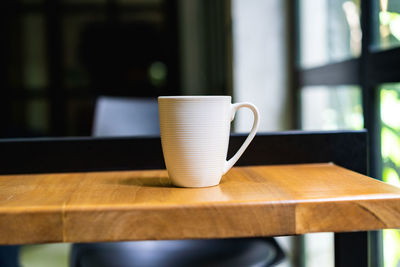 Close-up of coffee cup on table