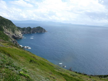 Scenic view of sea and cliff