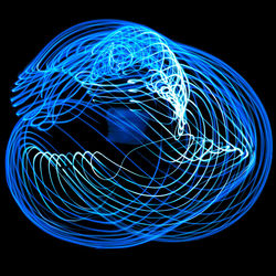 Close-up of light trails over black background
