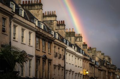 Low angle view of rainbow over building