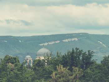 View of temple against cloudy sky