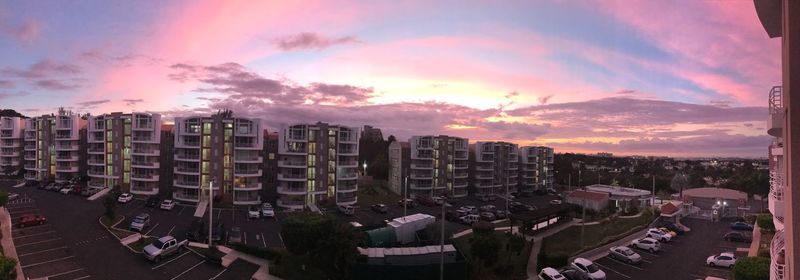 Panoramic view of cityscape against sky during sunset