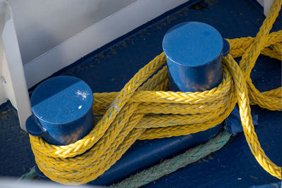 High angle view of rope tied on metal