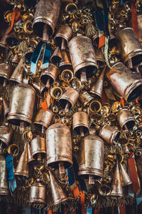 Close-up of metallic bells for sale at market