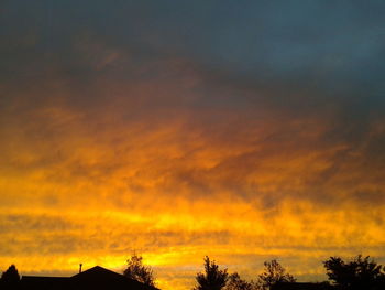 Low angle view of cloudy sky at sunset