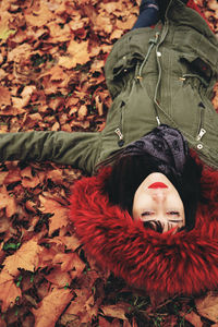 Portrait of woman with autumn leaves