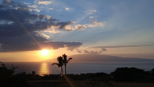 Scenic view of sea against cloudy sky